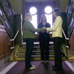 Glenna DeJong and Marsha Caspar take their vows together as Ingham County Clerk Barb Byrum officiates